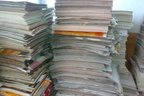 舊書本再造紙過程中切除膠條程序